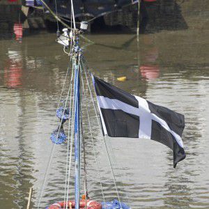 Fishing boat flying the Cornwall flag of St Piran